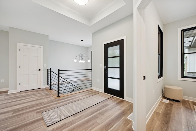 3909 54th St, Edina, MN 55424 - entrance foyer with a chandelier, plenty of natural light, and light wood finished floors