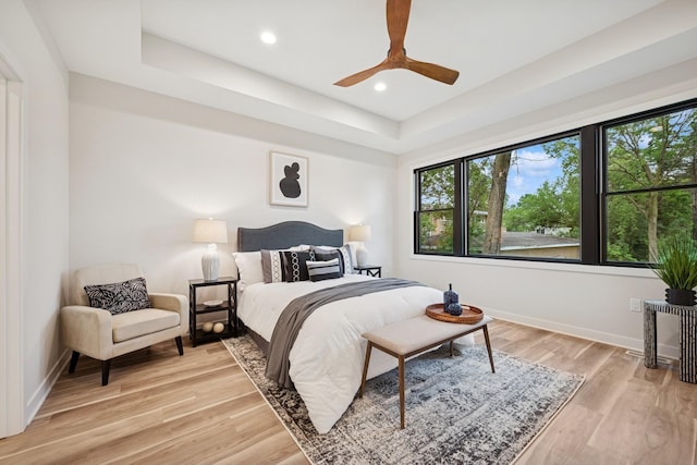 3909 54th St, Edina, MN 55424 - bedroom with a raised ceiling, light wood finished floors, recessed lighting, and ceiling fan