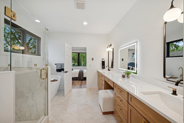 3909 54th St, Edina, MN 55424 - ensuite bathroom with marble finish flooring, healthy amount of natural light, double vanity, a marble finish shower, and recessed lighting