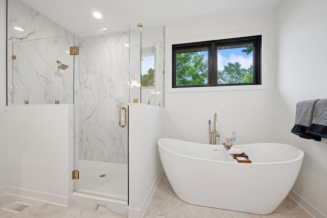 3909 54th St, Edina, MN 55424 - bathroom with marble finish floors, a soaking tub, a marble finish shower, and recessed lighting
