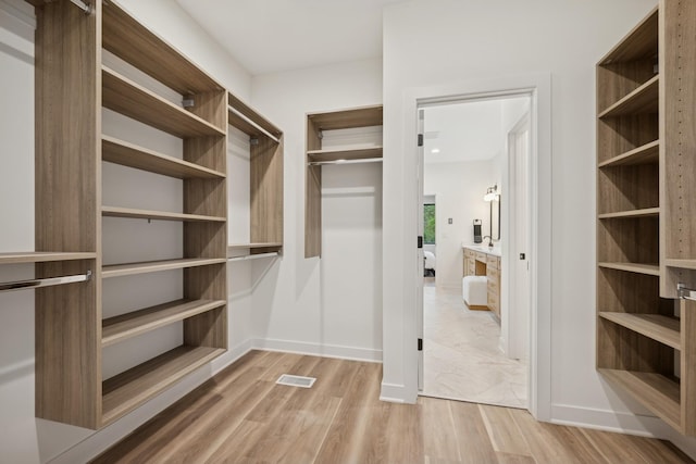 3909 54th St, Edina, MN 55424 - walk in closet with light wood-type flooring
