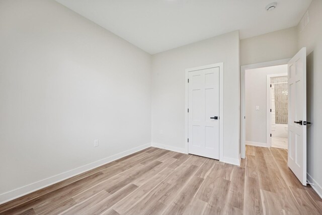 3909 54th St, Edina, MN 55424 - unfurnished bedroom featuring light wood finished floors and baseboards