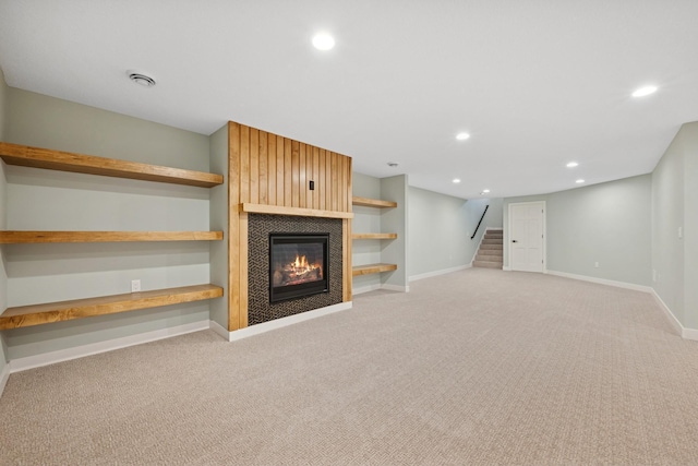 3909 54th St, Edina, MN 55424 - unfurnished living room with recessed lighting, light colored carpet, a fireplace, and stairs