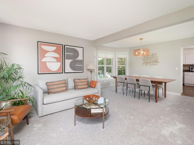 20108 Calgary Trl, Empire Twp, MN 55024 - carpeted living area with a chandelier and baseboards