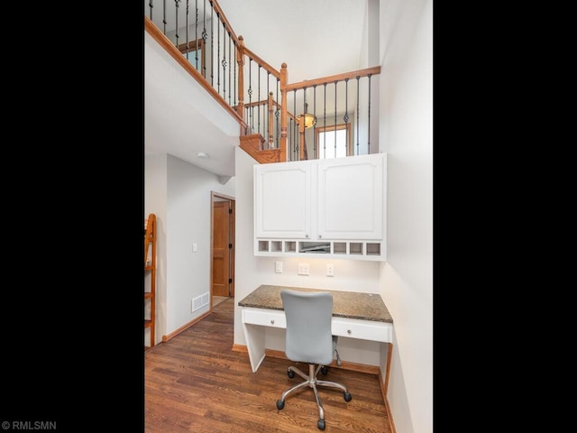 20108 Calgary Trl, Empire Twp, MN 55024 - office space with built in desk, a towering ceiling, and wood finished floors