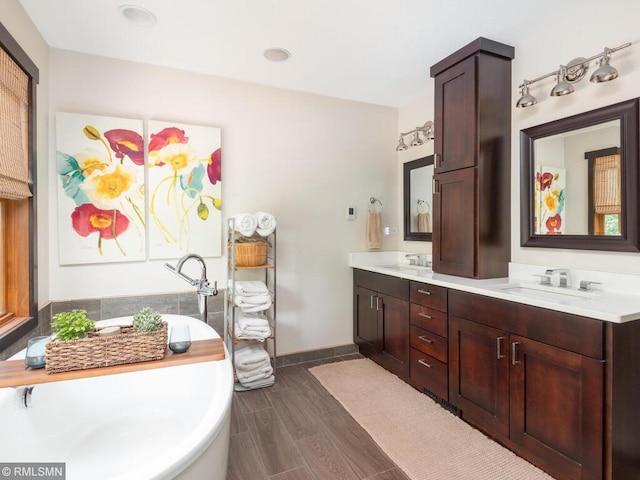 20108 Calgary Trl, Empire Twp, MN 55024 - full bath featuring a soaking tub, double vanity, and wood finished floors