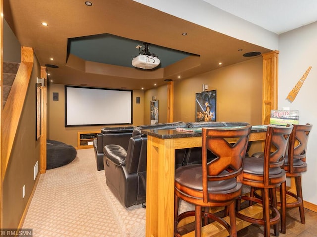 20108 Calgary Trl, Empire Twp, MN 55024 - cinema room with a dry bar, a tray ceiling, and recessed lighting