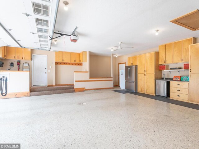 20108 Calgary Trl, Empire Twp, MN 55024 - garage with freestanding refrigerator, a garage door opener, and fridge