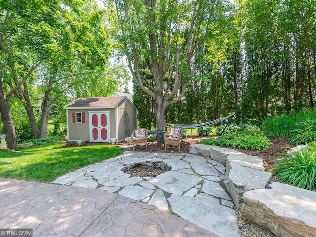 20108 Calgary Trl, Empire Twp, MN 55024 - view of patio featuring a shed and an outdoor fire pit