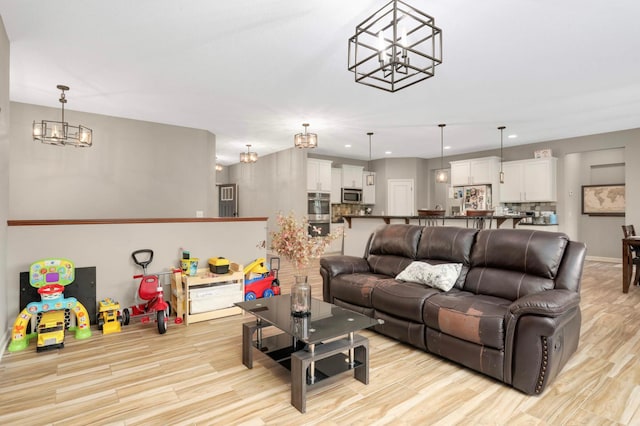 11950 75th St NE, Otsego, MN 55301 - living room with a chandelier, light wood-type flooring, and recessed lighting