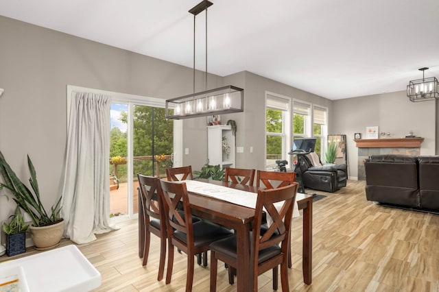 11950 75th St NE, Otsego, MN 55301 - dining area featuring a chandelier, light wood-style floors, and healthy amount of natural light