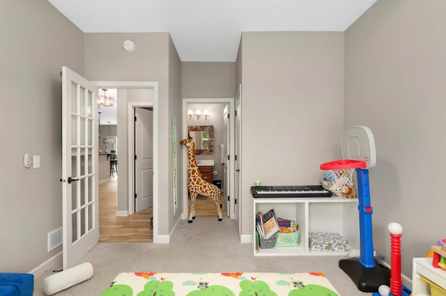 11950 75th St NE, Otsego, MN 55301 - recreation room featuring carpet floors and a chandelier