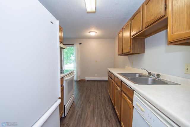 2417 Demores Dr S Unit 2, Fargo, ND 58103 - kitchen with white appliances, light countertops, a baseboard radiator, dark wood-style flooring, and brown cabinetry