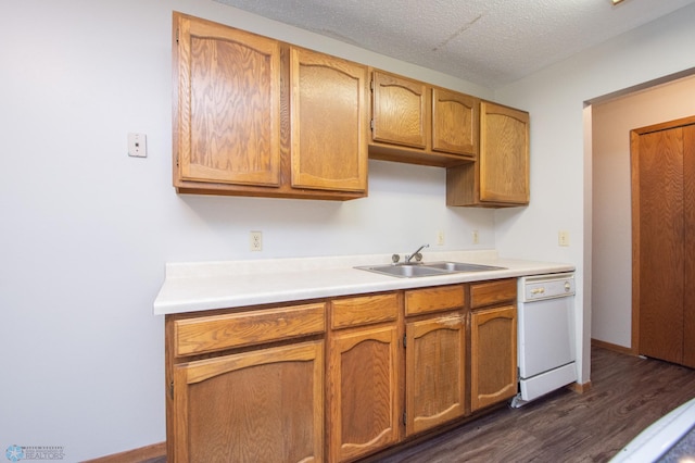 2417 Demores Dr S Unit 2, Fargo, ND 58103 - kitchen with white dishwasher, dark wood-style flooring, light countertops, and brown cabinetry