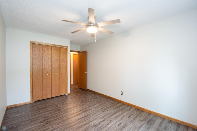 2417 Demores Dr S Unit 2, Fargo, ND 58103 - unfurnished bedroom with wood finished floors, a closet, and ceiling fan