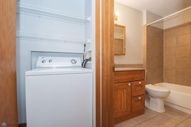2417 Demores Dr S Unit 2, Fargo, ND 58103 - laundry room featuring washer / dryer and light tile patterned floors