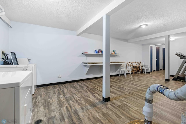 2417 Demores Dr S Unit 2, Fargo, ND 58103 - workout room with washing machine and dryer, a textured ceiling, and wood finished floors