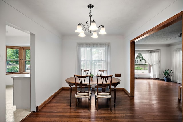 1442 Como Ave, Saint Paul, MN 55108 - dining room featuring wood finished floors, a chandelier, and a ceiling fan