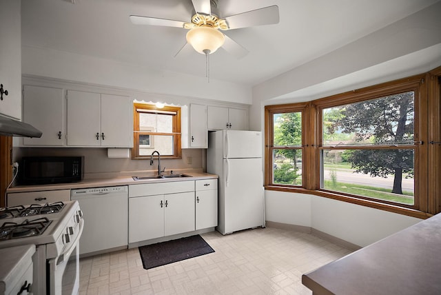 1442 Como Ave, Saint Paul, MN 55108 - kitchen featuring white appliances, white cabinets, and light countertops