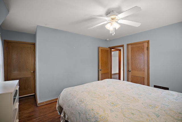 1442 Como Ave, Saint Paul, MN 55108 - bedroom with dark wood-style floors and ceiling fan