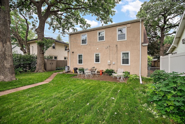 1442 Como Ave, Saint Paul, MN 55108 - back of house featuring a fenced backyard and stucco siding
