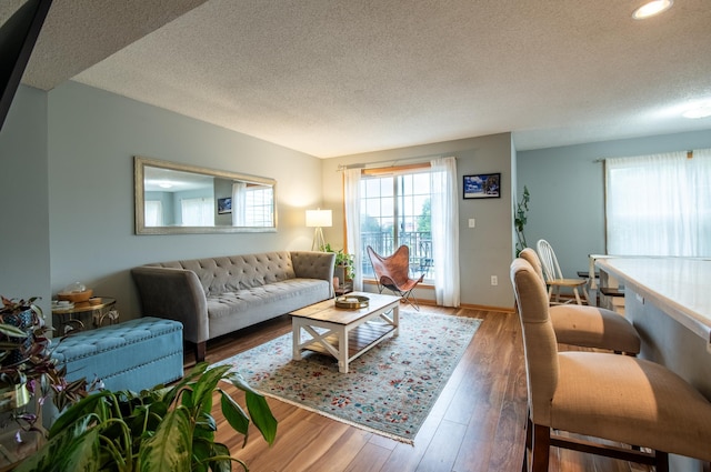 5724 4th St NE, Fridley, MN 55432 - living room with a textured ceiling, wood finished floors, and recessed lighting