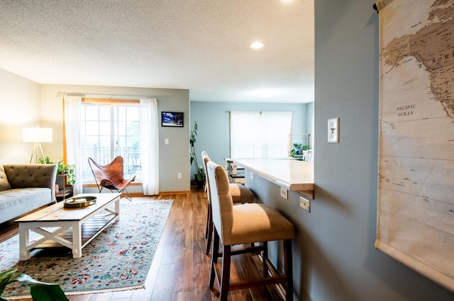 5724 4th St NE, Fridley, MN 55432 - living area featuring wood finished floors, recessed lighting, and a textured ceiling