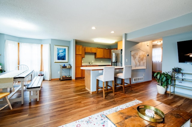 5724 4th St NE, Fridley, MN 55432 - living area with light wood finished floors, recessed lighting, and a textured ceiling
