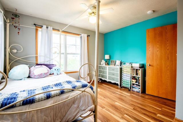 5724 4th St NE, Fridley, MN 55432 - bedroom with wood finished floors and a ceiling fan