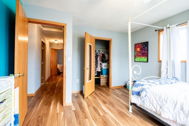 5724 4th St NE, Fridley, MN 55432 - bedroom with light wood-type flooring and a closet