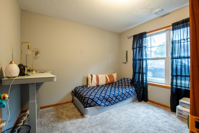 5724 4th St NE, Fridley, MN 55432 - carpeted bedroom featuring a textured ceiling and baseboards