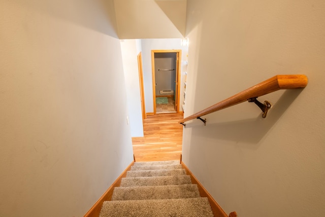 5724 4th St NE, Fridley, MN 55432 - stairs featuring baseboards and wood finished floors