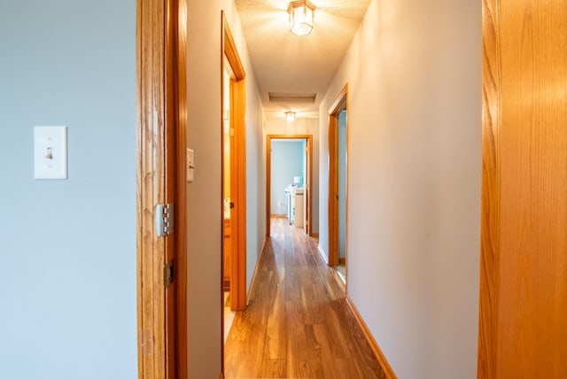 5724 4th St NE, Fridley, MN 55432 - corridor featuring light wood-style floors and baseboards