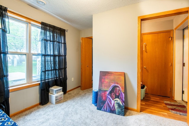 5724 4th St NE, Fridley, MN 55432 - carpeted bedroom featuring a textured ceiling and baseboards