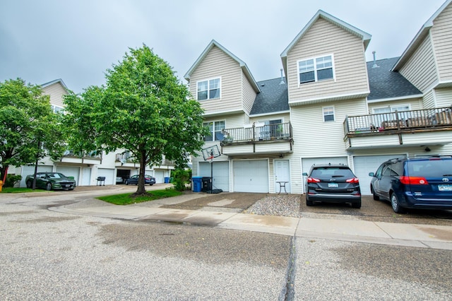 5724 4th St NE, Fridley, MN 55432 - view of property with driveway, a garage, and a shingled roof