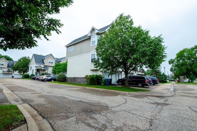 5724 4th St NE, Fridley, MN 55432 - view of asphalt street featuring curbs and a residential view