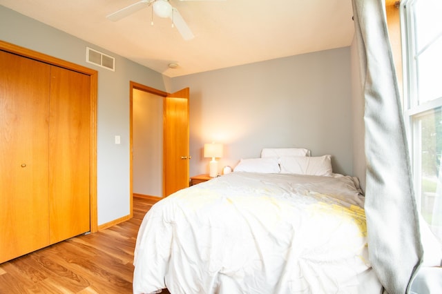 5724 4th St NE, Fridley, MN 55432 - bedroom featuring light wood-type flooring, a ceiling fan, and a closet