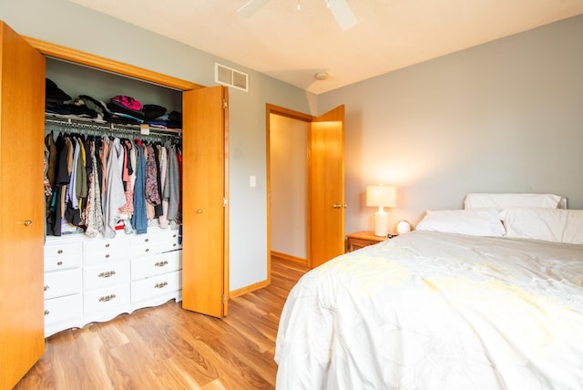 5724 4th St NE, Fridley, MN 55432 - bedroom with light wood-style floors, a closet, and ceiling fan