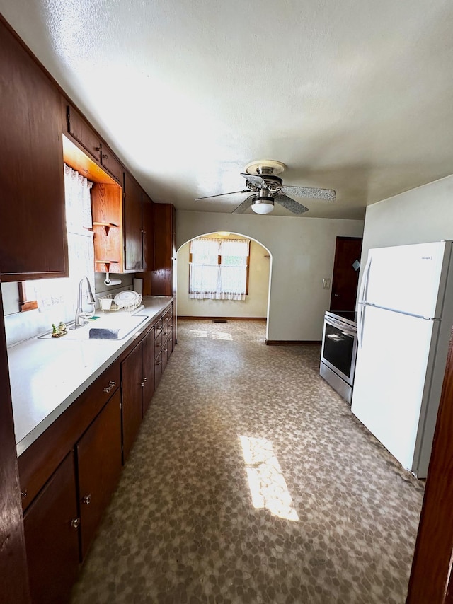 302 30th Ave N, Saint Cloud, MN 56303 - kitchen with freestanding refrigerator, electric range, healthy amount of natural light, and ceiling fan