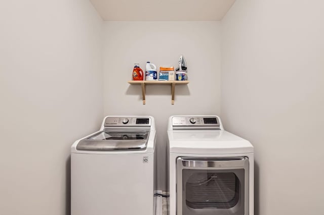 15141 Partridge St NW, Andover, MN 55304 - laundry area featuring washing machine and clothes dryer