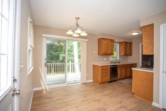 29930 Nathan Ct, Lindstrom, MN 55045 - kitchen with brown cabinets, appliances with stainless steel finishes, light countertops, and light wood-type flooring