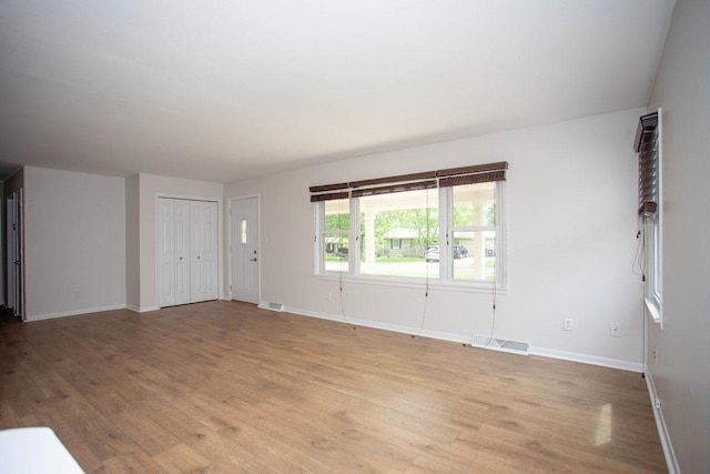 29930 Nathan Ct, Lindstrom, MN 55045 - unfurnished living room featuring light wood-style floors and baseboards