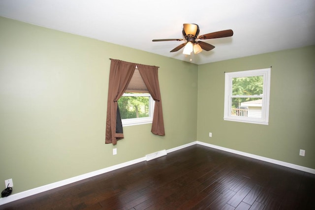 29930 Nathan Ct, Lindstrom, MN 55045 - unfurnished room featuring plenty of natural light, a ceiling fan, and dark wood-style flooring