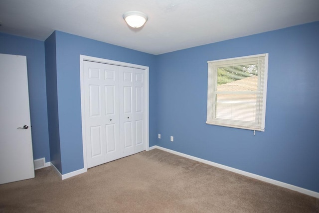 29930 Nathan Ct, Lindstrom, MN 55045 - unfurnished bedroom featuring a closet and carpet floors