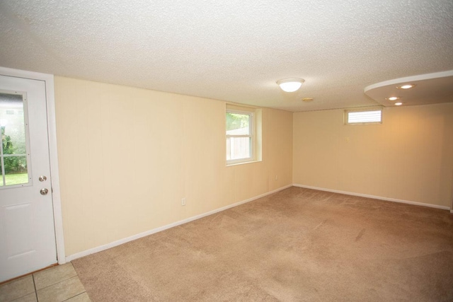29930 Nathan Ct, Lindstrom, MN 55045 - below grade area featuring a textured ceiling, light carpet, and healthy amount of natural light