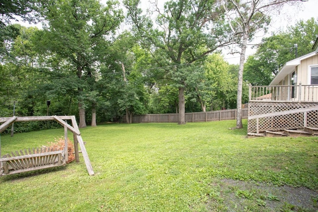 29930 Nathan Ct, Lindstrom, MN 55045 - view of yard featuring a deck and view of wooded area