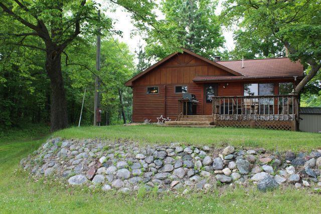 47393 209th Pl, Mcgregor, MN 55760 - back of house with a wooden deck, a yard, and board and batten siding