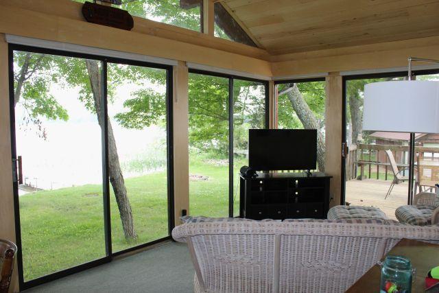 47393 209th Pl, Mcgregor, MN 55760 - sunroom featuring wood ceiling, lofted ceiling, plenty of natural light, and carpet