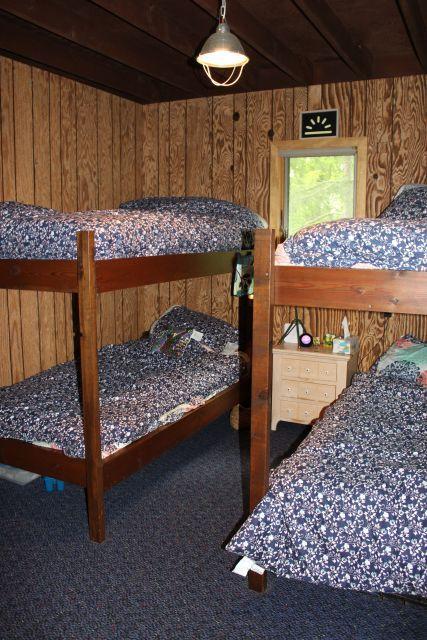 47393 209th Pl, Mcgregor, MN 55760 - carpeted bedroom featuring wooden walls and beam ceiling
