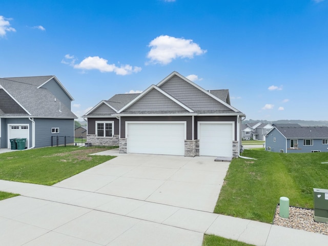 837 Towne Dr NE, Byron, MN 55920 - craftsman house featuring an attached garage, stone siding, a front lawn, and driveway